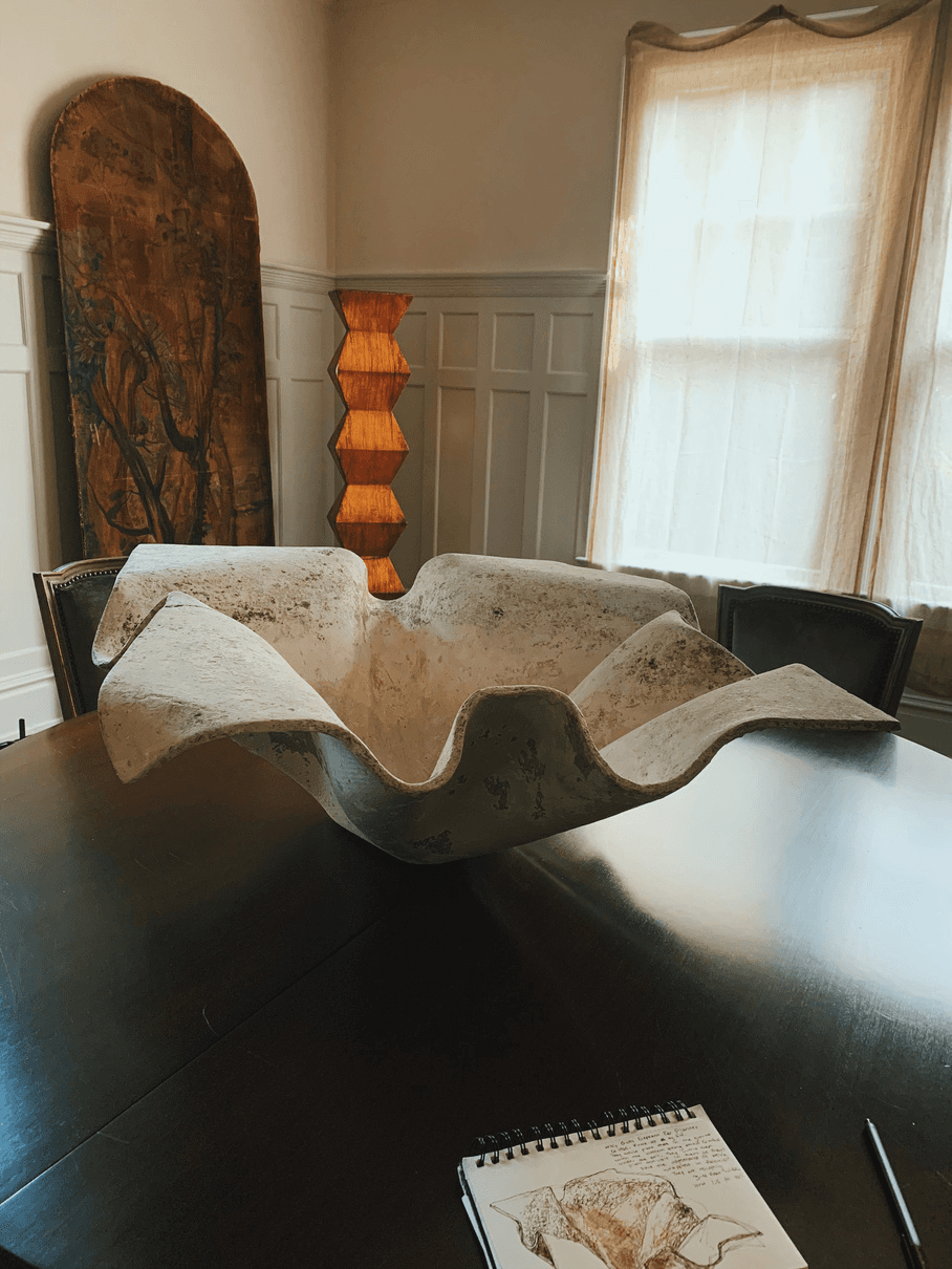 Dining room — castle door, sculptural bowl, lamp