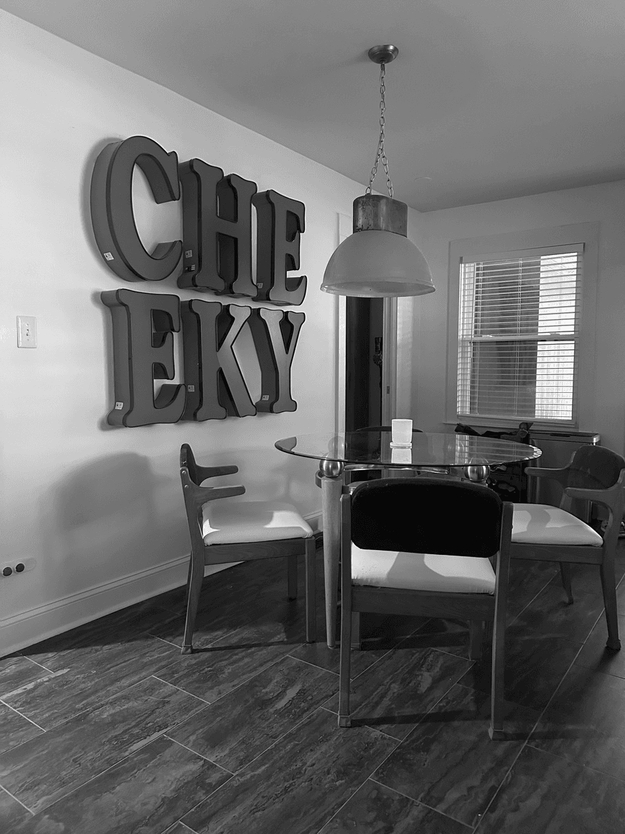Dining room with CHEEKY letters